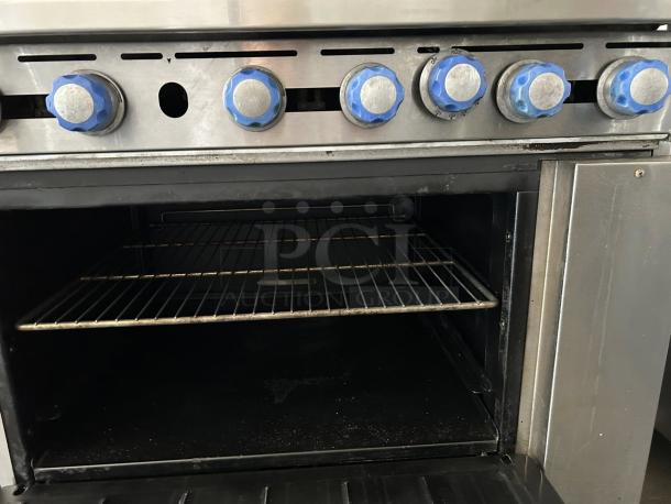 Imperial IR-6 restaurant range with 6 burners, 1 oven, natural gas, 36". Tested, working. Blue control knobs visible.