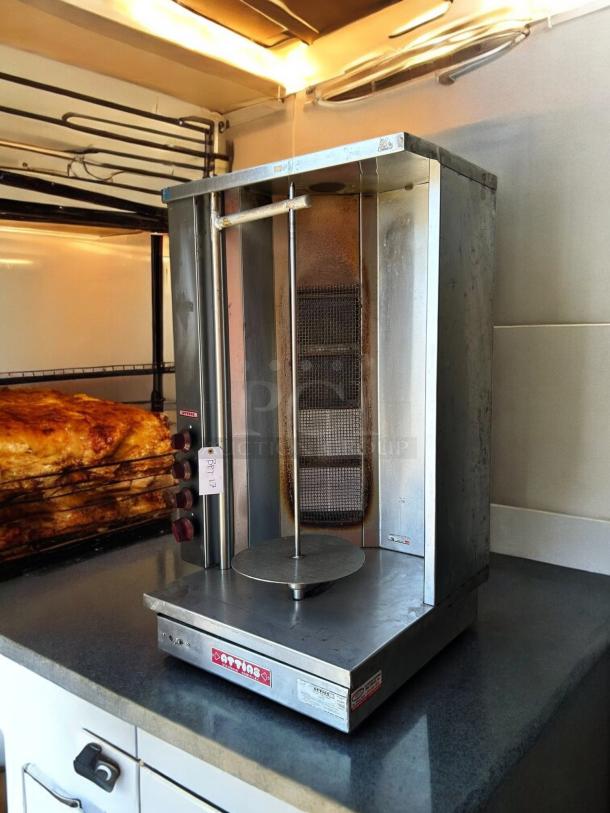 Attias GRY-4 Gyro & Shawarma Machine with 4 burners and 1 spit, in good condition, tested and working.