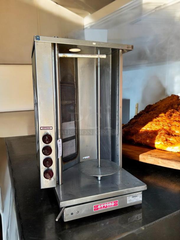 Attias GRY-4 gyro and shawarma machine with 4 burners and 1 spit in good condition. Tested and working.