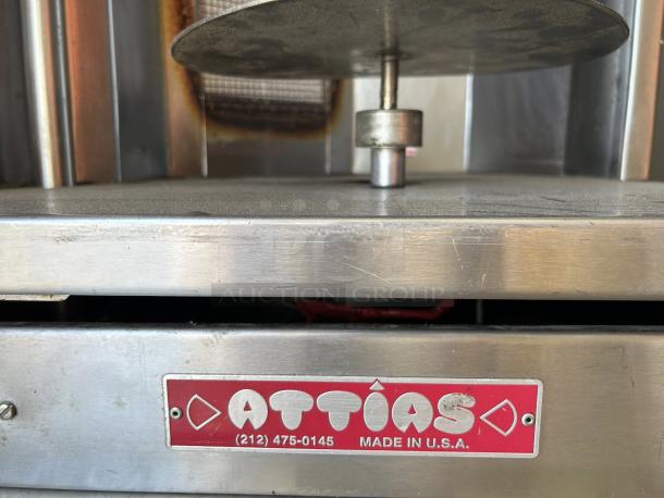 Attias GRY-4 Gyro & Shawarma Machine, 4 burners, good condition, tested, stainless steel, "Attias Made in USA" label.