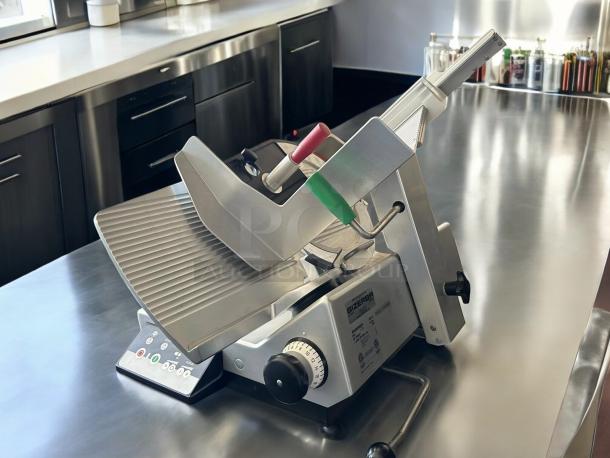 Bizerba Model L-22 automatic meat slicer with 13" blade, safety dial, aluminum body, 1/2 hp 120V, tested and working.