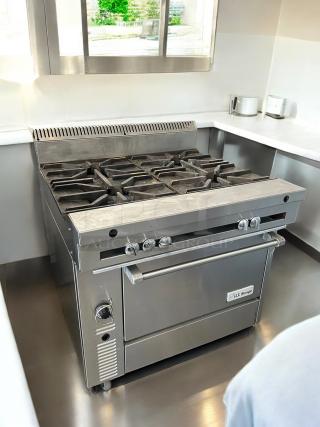 Garland M44R Master Series 34" natural gas range with 4 burners, standard oven, 180,000 BTU, tested and working condition.