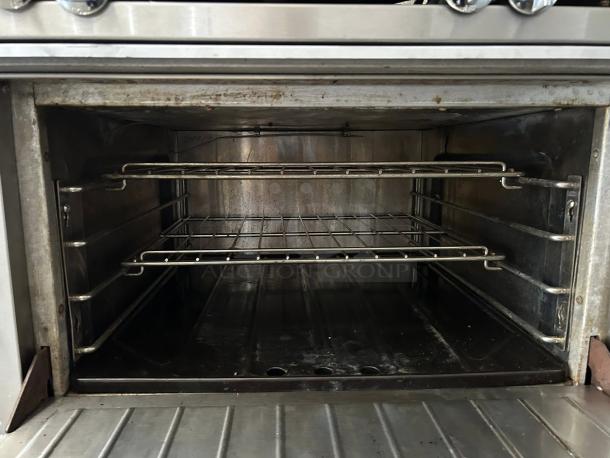 Garland M44R Master Series range oven interior, stainless steel, two racks, lightly used, 34" wide, natural gas, 180,000 BTU.