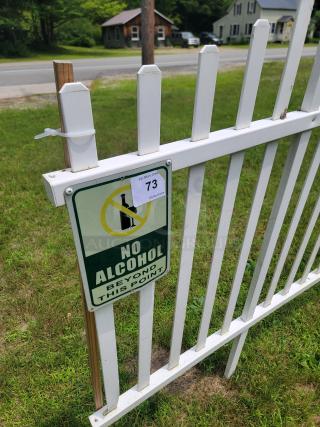 10 sections of white 4x8 plastic fence, featuring a "No Alcohol Beyond This Point" sign. Good condition, slight wear.