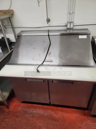 Avantco 178SSPT48HC 48" commercial prep refrigerator with stainless steel top, dual doors, and power cord visible.
