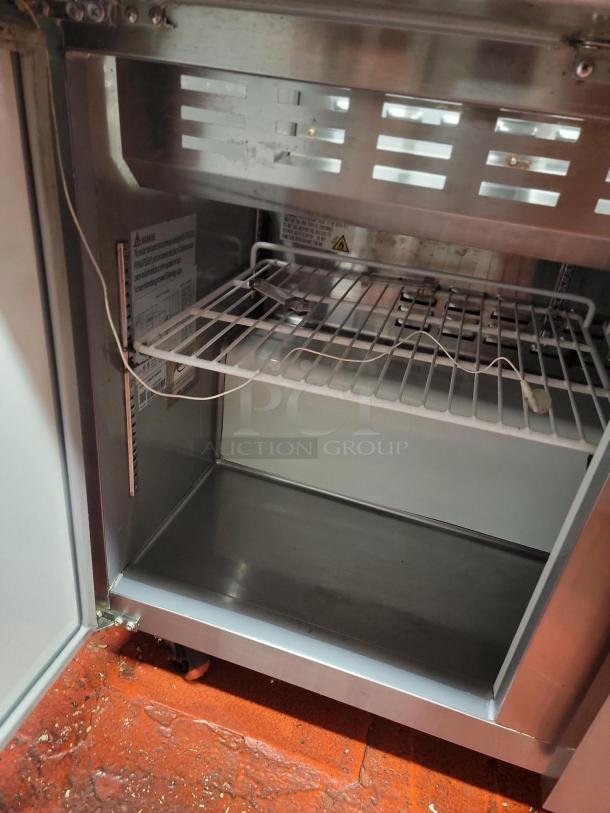 Avantco 48" commercial prep refrigerator model 178SSPT48HC interior view, showing wire shelf and stainless steel construction.