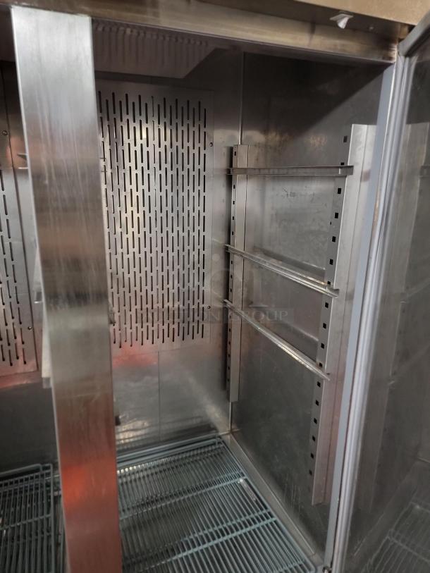Avantco commercial 2-door reach-in refrigerator, model 178CFD2RR, stainless steel interior, wire shelves, pristine condition.