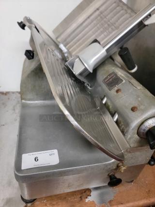 Hobart Commercial Meat Slicer, Model 1712R, heavy-duty, reliable; visible wear, suitable for delis/restaurants. Auction tag present.