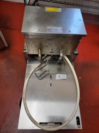 Southbend Mobile Fryer Oil Filter System with hose and spare filters; metal casing; ideal for commercial kitchens; visible labels.