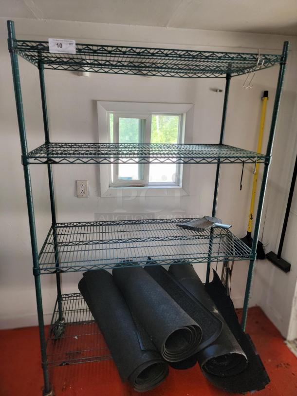 Green Metro commercial wire shelving unit with included meat saws and rubber mats. Ideal for kitchens or storage areas.