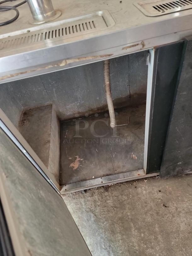 Beverage-Air DD58 kegerator interior. Four taps, stainless steel finish, excellent condition. Ideal for commercial use.