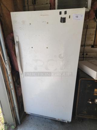 Frigidaire FFU17M7HWF upright freezer, 17.0 cu ft, white, used, visible wear, auction tag "13" attached, buyer must remove.