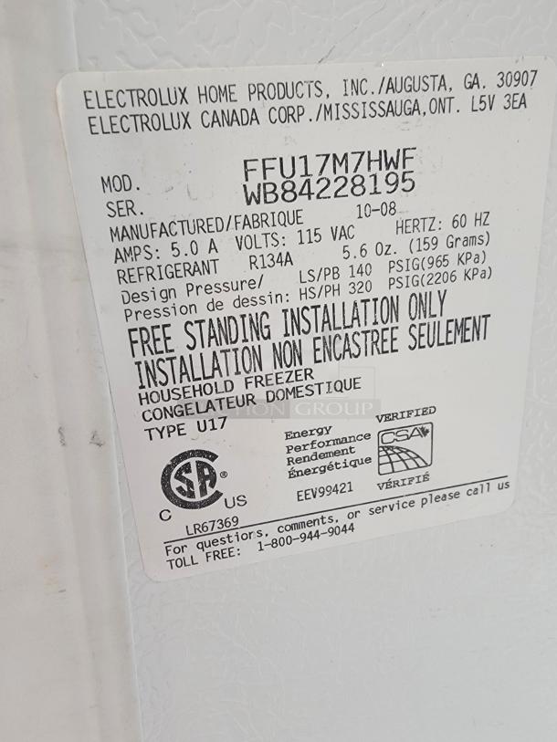 Frigidaire FFU17M7HWF upright freezer label showing model, serial number, 5.0 amps, 115 VAC, R134A refrigerant.