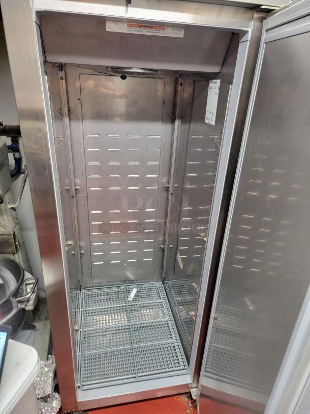 Hoshizaki CF1S-SF commercial single door upright freezer, durable stainless steel, spacious interior, visible warning labels.