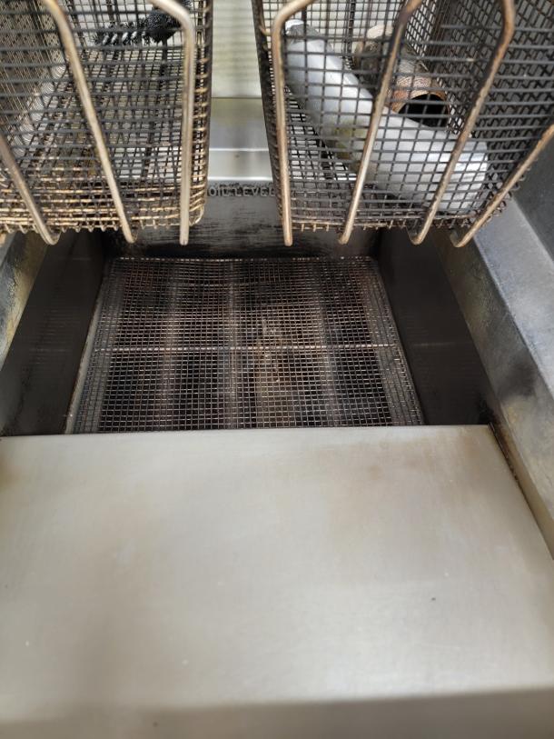 Imperial IFS-40 commercial deep fryer, showing dual fryer baskets and interior, robust construction, good condition.