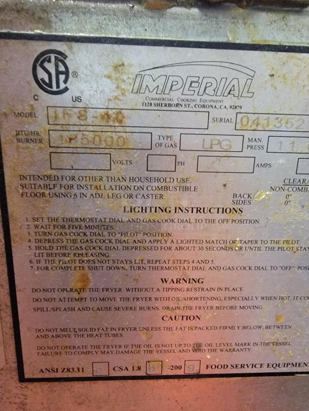 Imperial IFS-40 deep fryer label showing model, serial number, BTU rating, and LPG gas type with safety instructions.