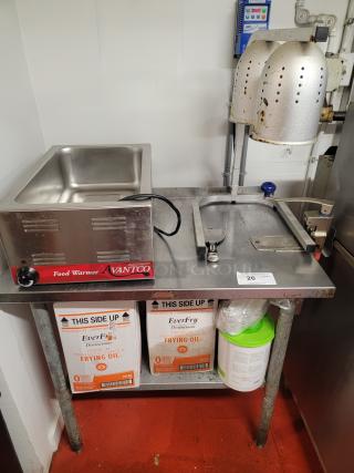 Complete hot holding station with Avantco food warmer, dual heat lamps, 3-foot stainless steel table, and EverFry oil boxes.