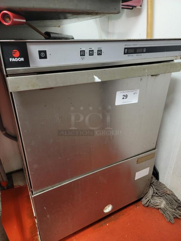Fagor AD48 commercial undercounter dishwasher, stainless steel, compact design, some visible wear, sticker labeled "29 QTY".
