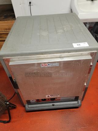 Metro C5 3 Series heated holding cabinet on casters, model C533-HLFS-U-GY. Used condition with visible wear.