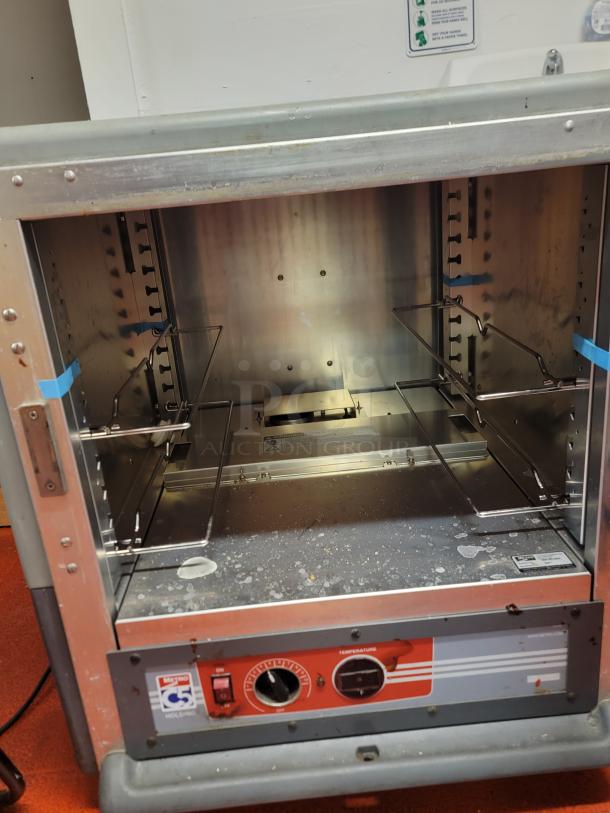 Metro C5 insulated heated holding cabinet on casters, model C533-HLFS-U-GY, open interior view, used condition.