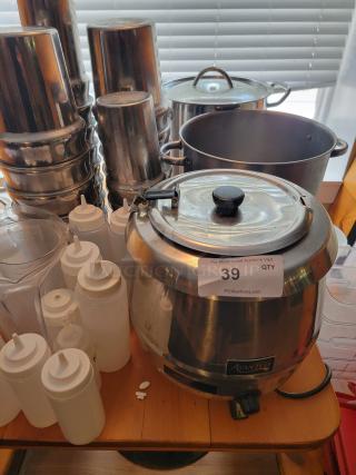 Assorted commercial kitchen supplies including stainless steel pots, condiment bottles, and an Avantco warmer, auction lot 39.