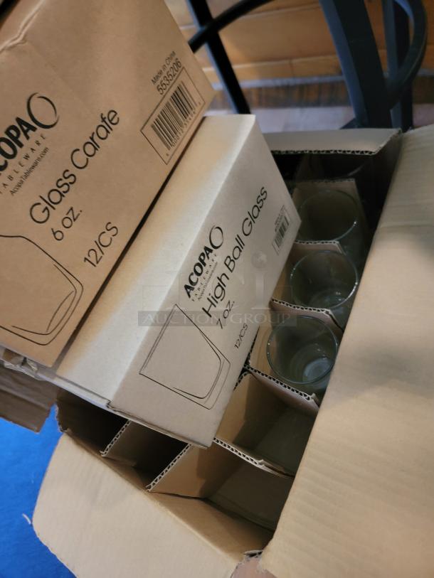 Massive glassware lot in boxes, featuring Acopa 6 oz carafes and 7 oz high ball glasses, sparkling clean condition.