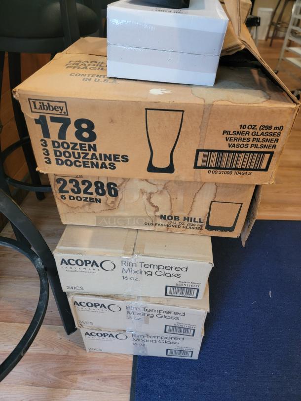 Massive glassware lot with Libbey pilsner and Acopa rim-tempered mixing glasses in boxes. Ideal for bars or events. Buyer must remove.