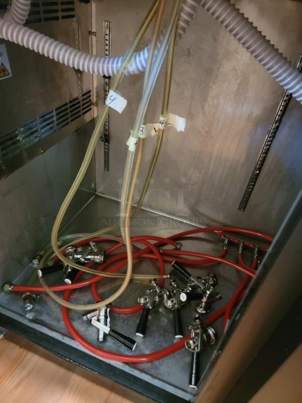 Avantco 70" Commercial Kegerator model 178UDD3HC interior view showing beer hoses and taps, in tested and working condition.