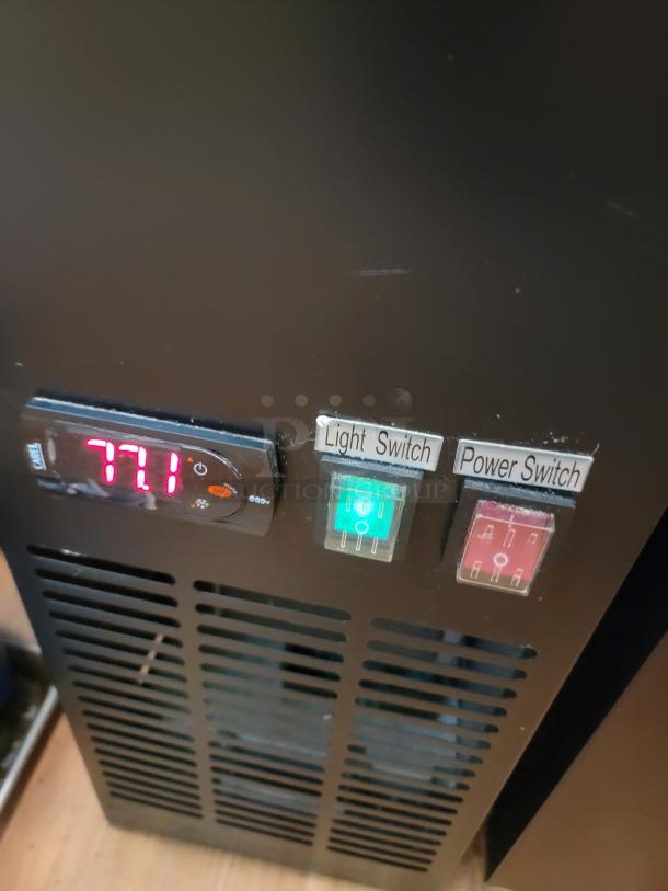 Avantco 70" Commercial Kegerator control panel with light and power switches, Model 178UDD3HC. Efficient refrigeration unit.