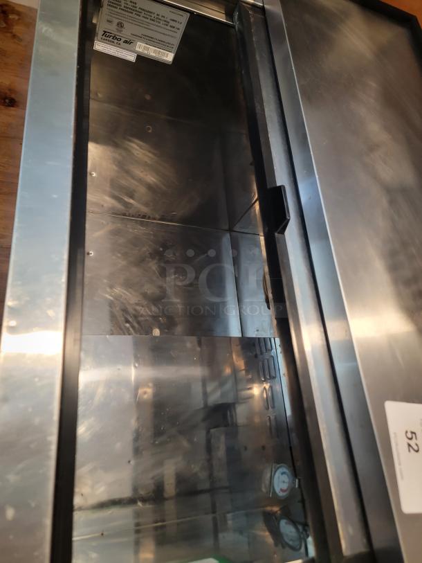 Turbo Air TBC-36SB undercounter bottle cooler, stainless steel interior, visible label with model details, excellent condition.