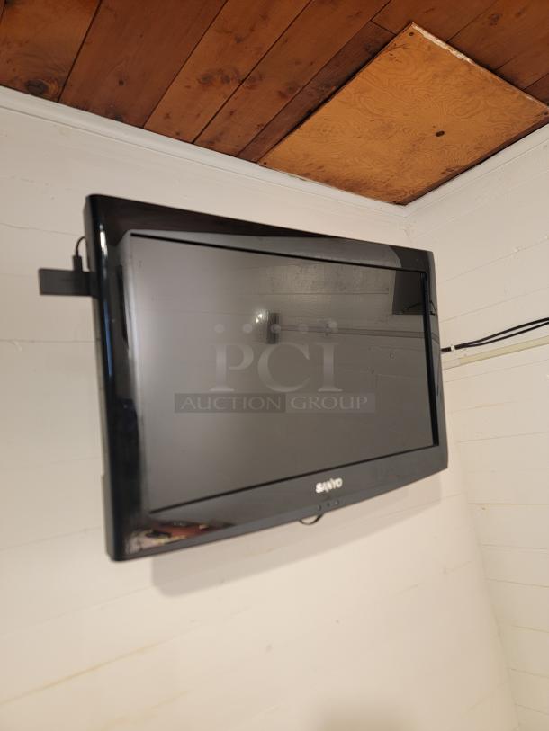 Wall-mounted Sanyo TV in black frame, in good condition, part of a bundle with Vizio E280B1. Versatile for any space.
