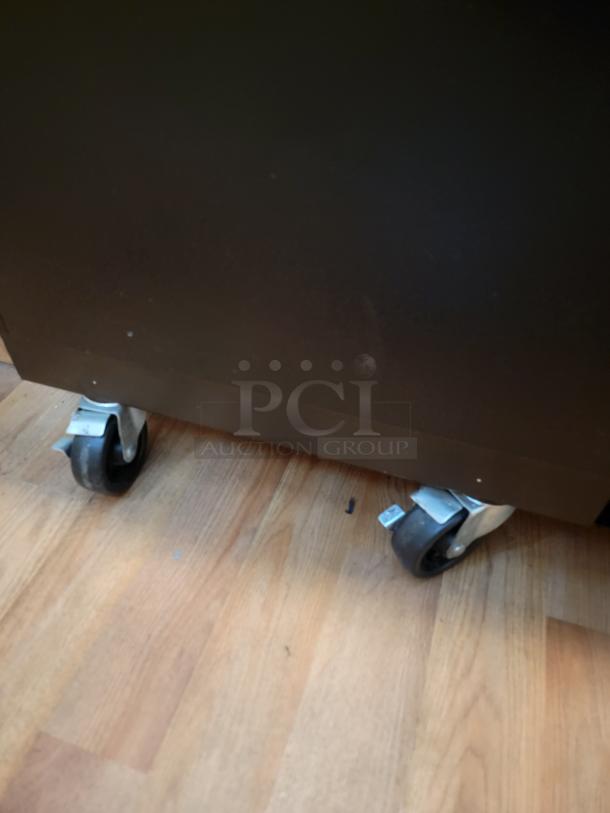 Turbo Air TBC-36SB bottle cooler, undercounter model, shown on floor with caster wheels, ideal for commercial use.