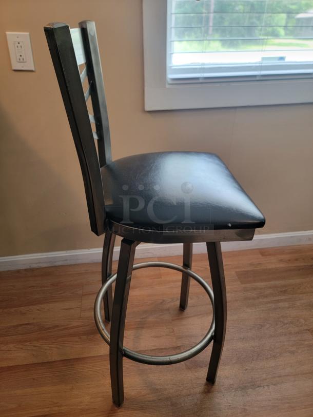 Lancaster Swivel Bar Stool, steel gray gloss finish, ladder-back design, cushioned seat, modern style, used condition.