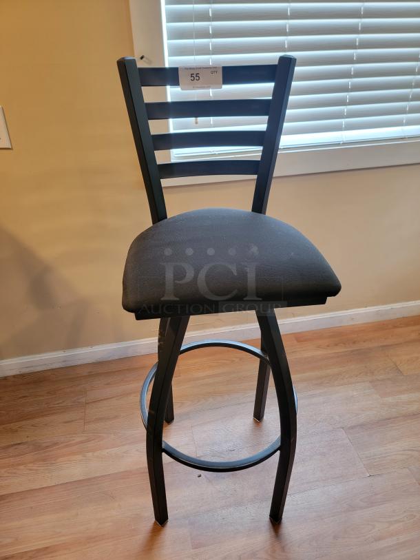 Lancaster 36" black swivel bar chair with a plush padded seat. Features a ladder-back design. Tag reads "55 QTY PC3furniture.com".