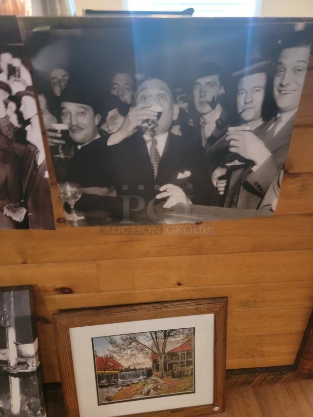 Unique wall art collection featuring black and white historical photo and framed scenic landscape. Eclectic decor lot.