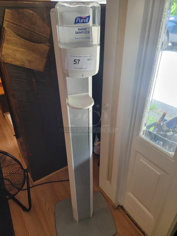 Purell automatic hand sanitizer dispenser stand, 52", ideal for businesses, features Purell branding, in good condition.