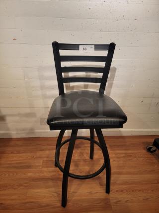 Black ladder back swivel bar stool, 31" seat height, by Lancaster. Features include elegant design and comfortable seating.