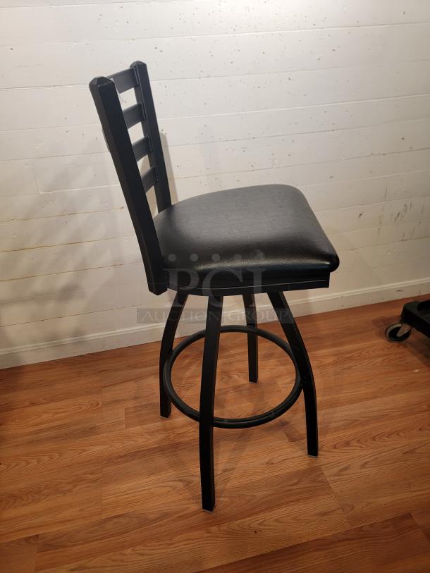 Black Lancaster ladder back swivel bar stool, 31" seat height, padded seat, excellent condition, ideal for bar or kitchen.