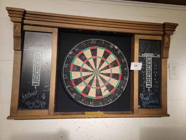 MD Sports DRB100 wall mount dart board cabinet set with battery-powered lighting. Includes chalk scoreboards. Light wear visible.
