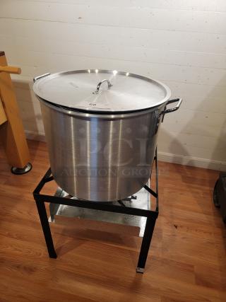Backyard Pro 80 Qt Aluminum Outdoor Propane Broiler/Steamer with lid on black stand, in good condition.