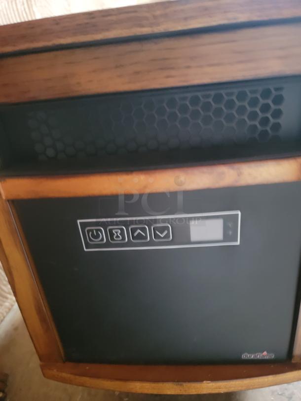 DuraFlame heater with wooden panel design, featuring control buttons and display. Part of a massive auction lot.