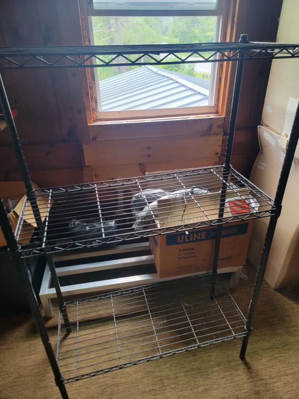 Metal wire shelving unit with three shelves, includes a Uline box. Used condition, part of complete office clearance.