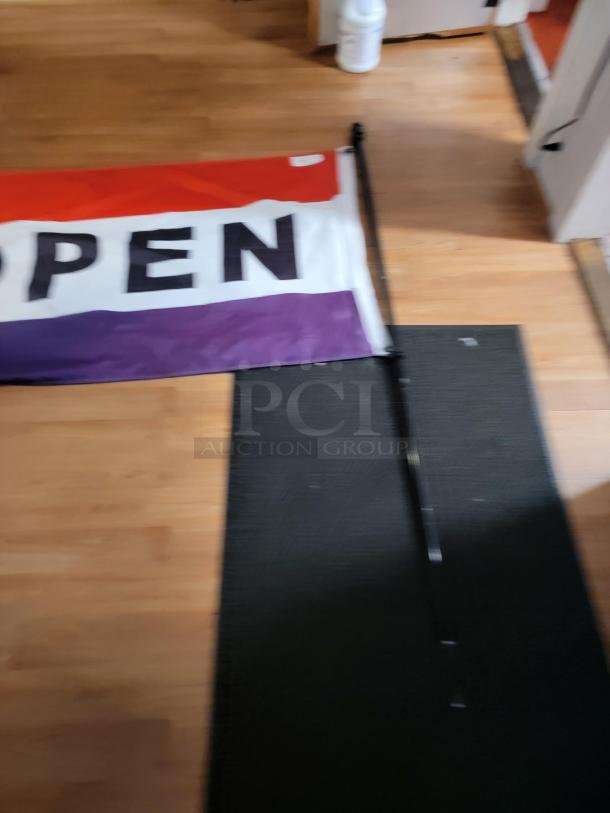 "OPEN" flag, 5'x3', in red, white, and purple with large black letters. Includes pole. Ideal for business visibility.