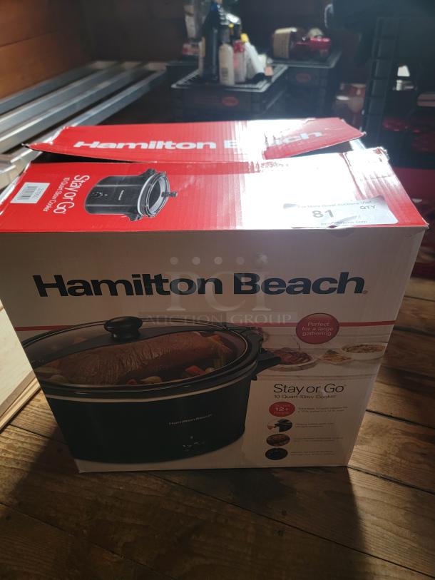 Two brand new Hamilton Beach Stay or Go 6-Quart Slow Cookers, sealed in box, with lid latch for easy transport, perfect for meals and potlucks.