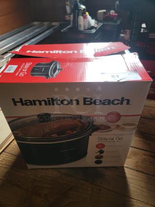 Two brand new Hamilton Beach Stay or Go 6-Quart Slow Cookers, sealed in box, with lid latch for easy transport, perfect for meals and potlucks.