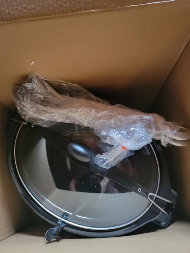 Brand new Hamilton Beach Stay or Go 6-Quart Slow Cooker in box, with lid latch visible. Perfect for meals and transport.