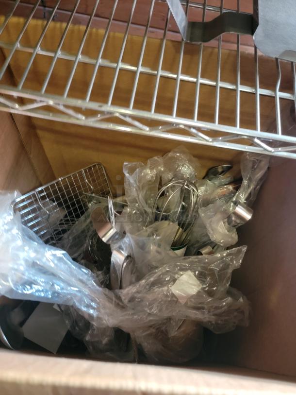 Extensive commercial kitchen supply lot, including chafing dishes, fry cutter, accessories, and more in a cardboard box.