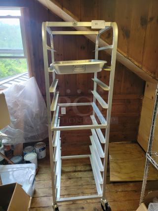 Advance Tabco commercial sheet pan rack on casters, holds multiple pans, aluminum, durable, excellent condition, mobile.