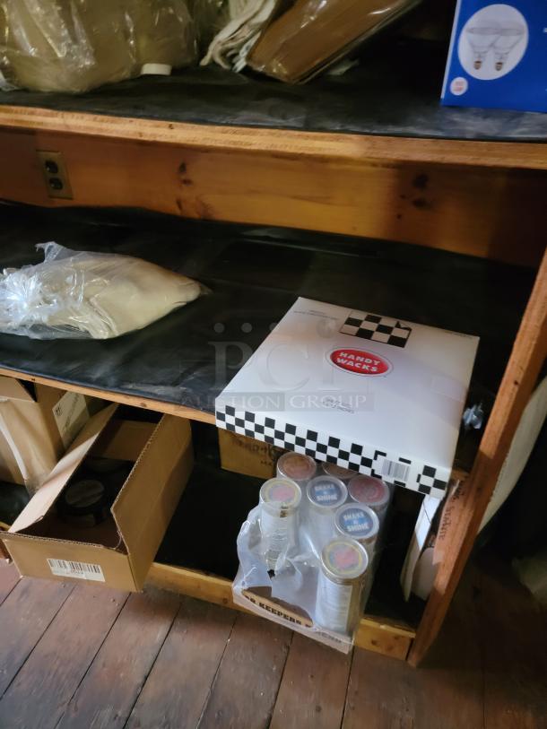 Commercial disposable and kitchen supply lot includes to-go containers, cups, bags, and cookware. Unopened, bulk packaging.
