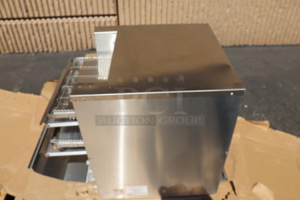Brand new Vollrath JT4HC dual conveyor toaster with minor scratches and dents. Stainless steel exterior.